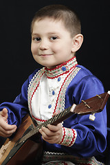 Image showing Little boy with balalaika