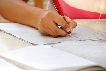 Image showing Schoolgirl doing her homework