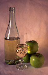 Image showing White wine and apples on painted background