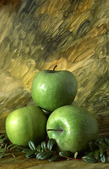 Image showing Three green apples on painted background