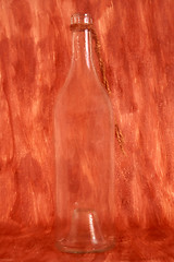 Image showing A bottle isolated on painted background