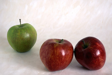 Image showing Three apples on painted background