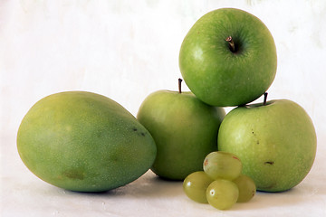 Image showing Green apple and mango on painted background