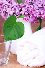 Image showing rolled towel, lilac and candle