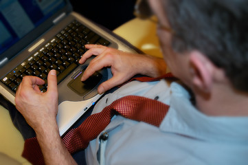 Image showing Businessman working with laptop computer