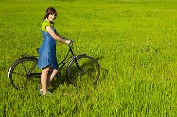 Image showing Girl with a bicycle