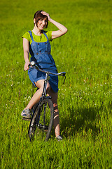 Image showing Girl with a bicycle