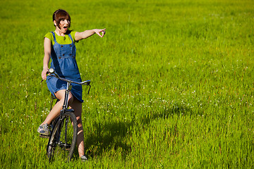 Image showing Girl with a bicycle