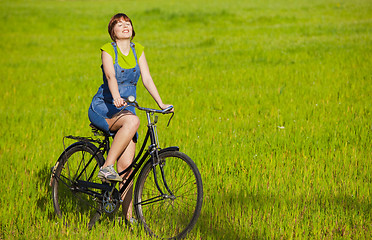 Image showing Girl with a bicycle