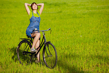 Image showing Girl with a bicycle