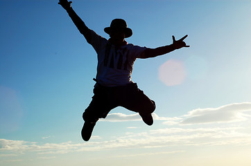 Image showing a man jumping from the sky