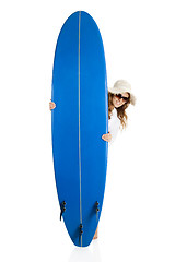 Image showing Woman with a surfboard