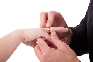 Image showing hand of a man putting a ring on the hand of a woman