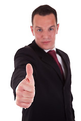 Image showing Young businessman with thumb raised as a sign of success