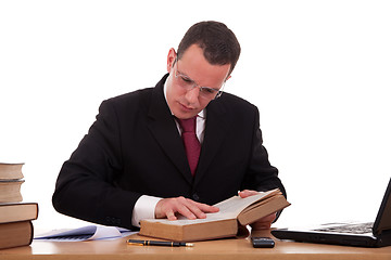 Image showing man on desk reading and studying