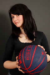 Image showing Brunette girl and basketball ball