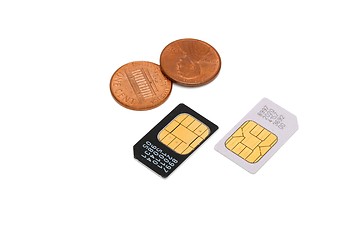 Image showing Two SIM cards for cellular phones and Americal cents isolated 