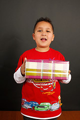 Image showing Boy holding a gift 