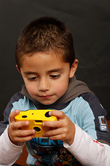 Image showing A boy with a disposable camera