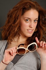 Image showing Girl trying on sunglasses