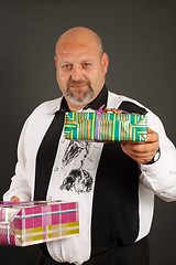 Image showing Man giving a wrapped present