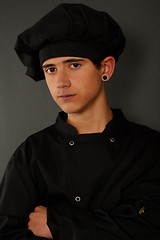 Image showing Young spanish cook with a black earring