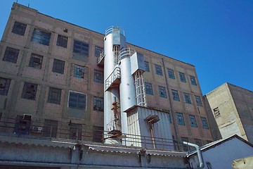 Image showing Old industrial building exterior with addition of a new tower