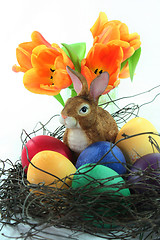 Image showing Easter basket with eggs and Easter bunny and tulip