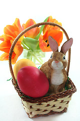 Image showing Easter basket with eggs and Easter bunny and tulips