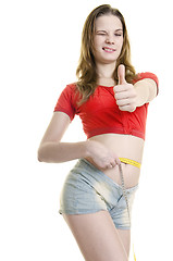 Image showing Happy girl with measure tape