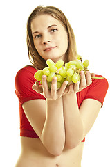 Image showing young woman holding  grapes