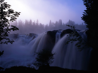 Image showing waterfall in fog mountain