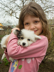 Image showing girl and puppy