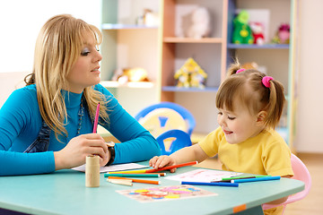 Image showing Teacher with child in preschool