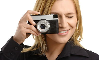 Image showing young woman taking a shot with photo camera