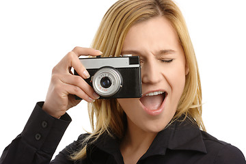 Image showing young woman taking a shot with photo camera