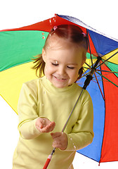 Image showing Cute child catching raindrops under umbrella