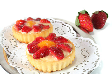 Image showing Strawberry tarts with mint