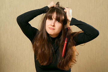 Image showing Hairbrush in female hair