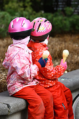 Image showing Cyclists eating ice cream