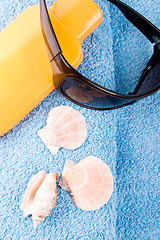 Image showing towel, sunglasses and lotion