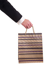 Image showing detail of a hand of a man doing shopping,with bags 