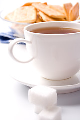 Image showing cup of tea, sugar and cookies 