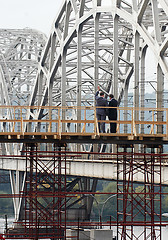 Image showing two businessman on the bridge
