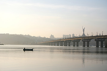 Image showing fisherman near the bridge