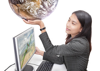 Image showing Office worker holding globe