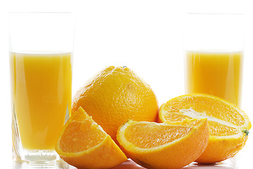 Image showing Oranges and two glasses of juice