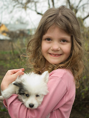 Image showing girl and puppy