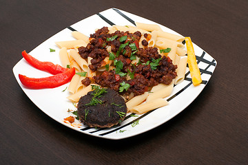 Image showing cutlet and pasta and sauce