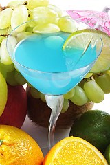 Image showing Blue cocktail among fruits